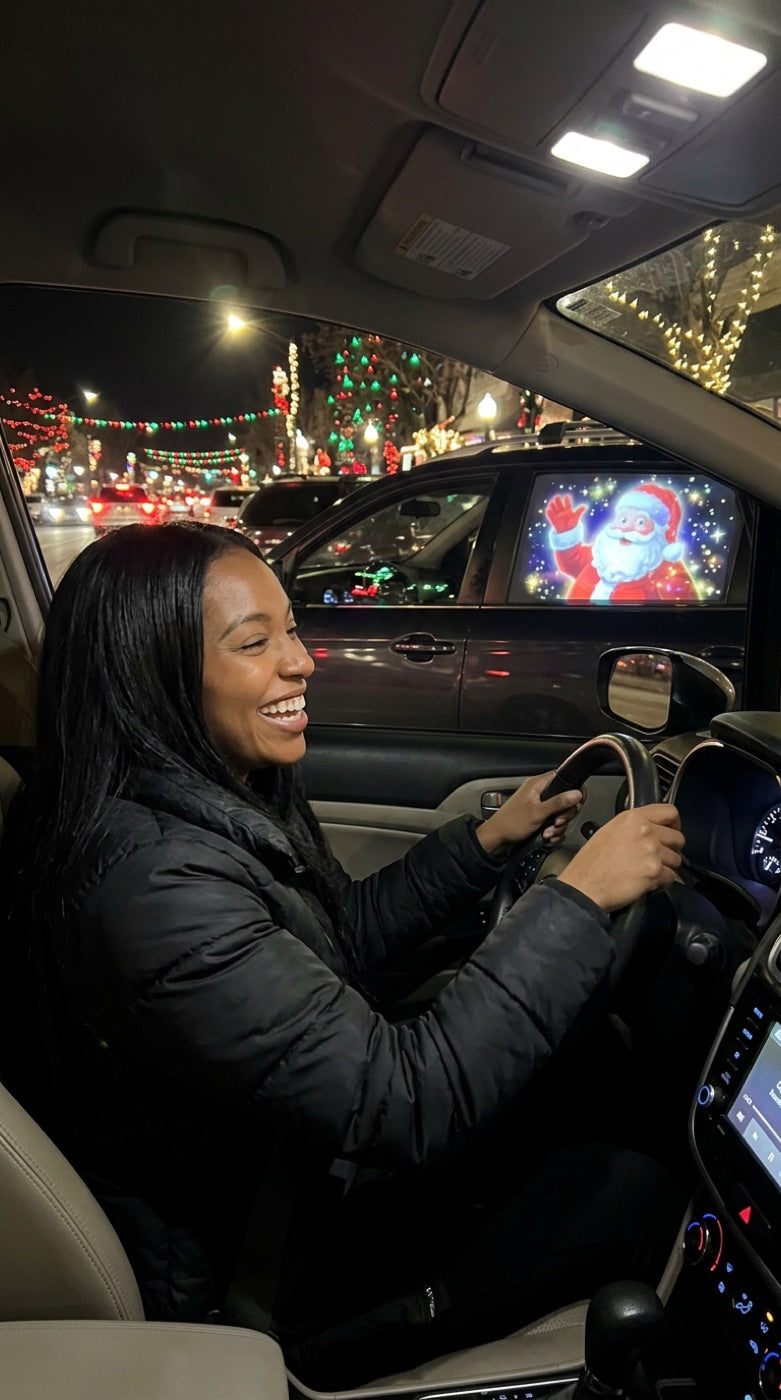 Driver laughing at a Santa projection