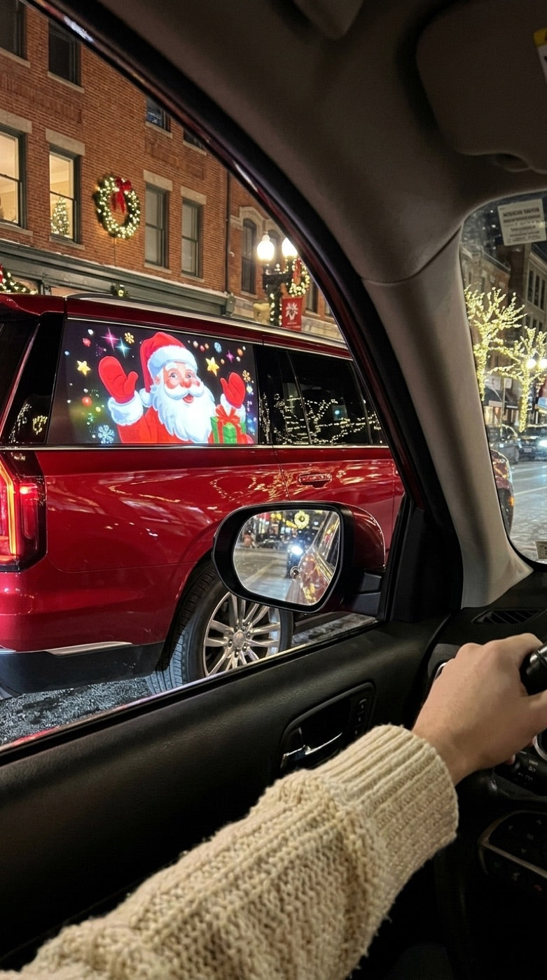 Santa projected on a car window on a festive street
